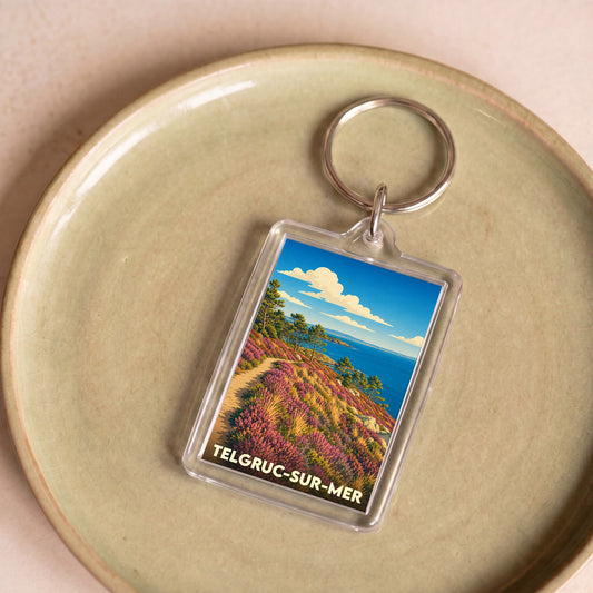 Porte-clés souvenir de la ville de Telgruc-sur-Mer avec une illustration stylisée de son paysage côtier.