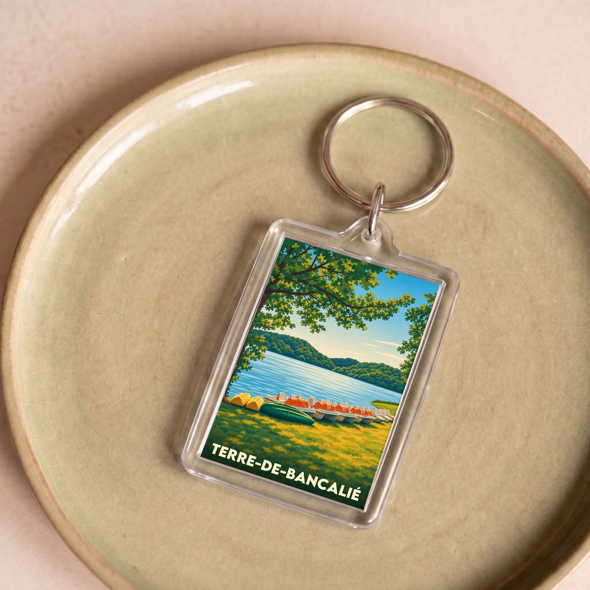 Porte-clés souvenir de la ville de Terre-de-Bancalié avec une illustration stylisée.