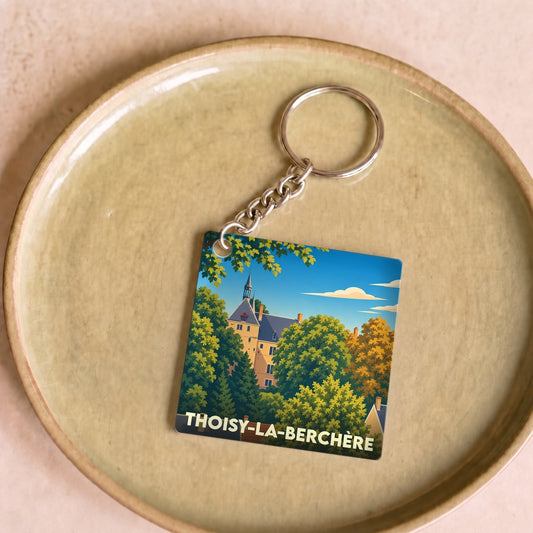 Porte-clés souvenir de la ville de Thoisy-la-Berchère avec une illustration stylisée de son château.