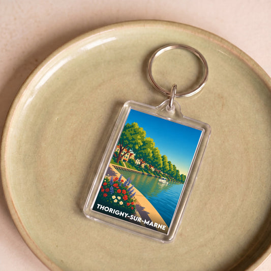 Porte-clés souvenir de la ville de Thorigny-sur-Marne avec une illustration stylisée.