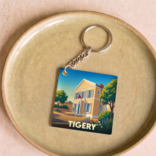 Porte-clés souvenir de la ville de Tigery avec une illustration stylisée.