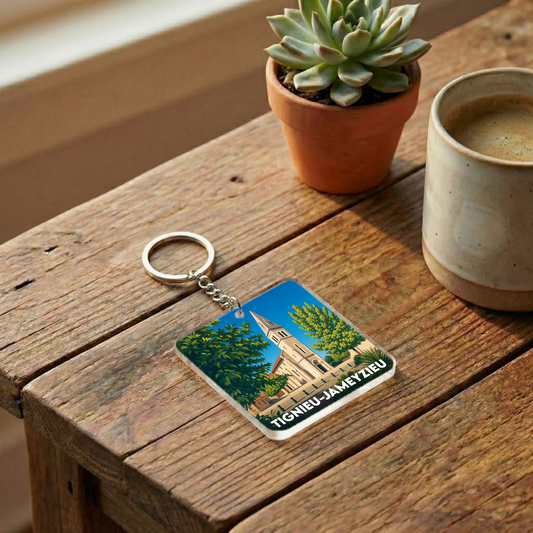 Porte-clés souvenir de la ville de Tignieu-Jameyzieu avec une illustration stylisée.