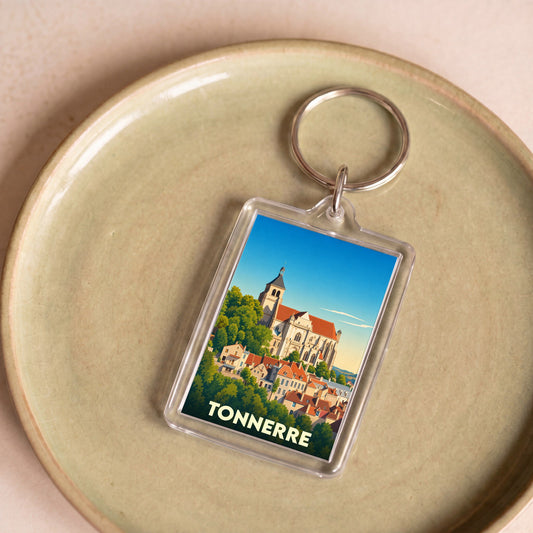 Porte-clés souvenir de la ville de Tonnerre avec une illustration stylisée.