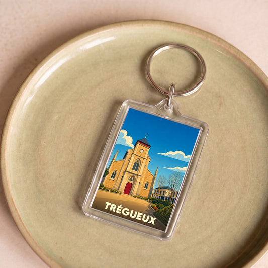 Porte-clés souvenir de la ville de Trégueux avec une illustration stylisée de son église.