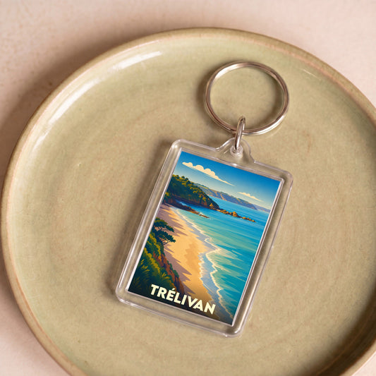 Porte-clés souvenir de la ville de Trélivan avec une illustration stylisée de bord de mer.