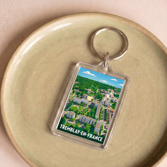 Porte-clés souvenir de la ville de Tremblay-en-France avec une illustration stylisée.