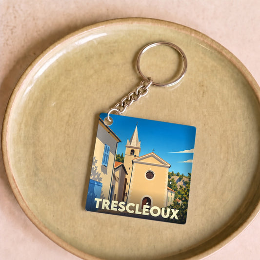 Porte-clés souvenir de la ville de Trescléoux avec une illustration stylisée de son église.