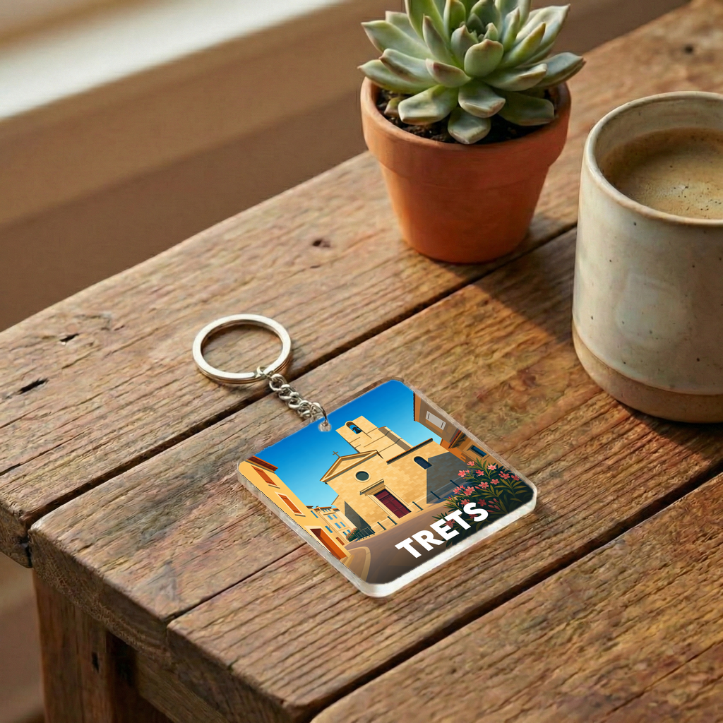 Porte-clés souvenir de la ville de Trets avec une illustration stylisée.