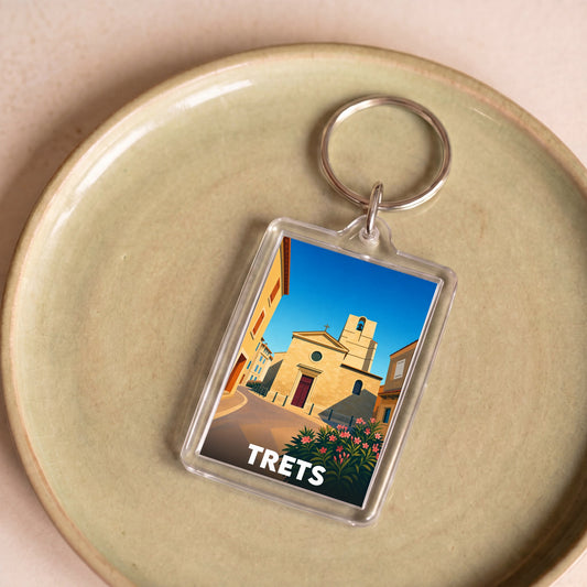 Porte-clés souvenir de la ville de Trets avec une illustration stylisée.
