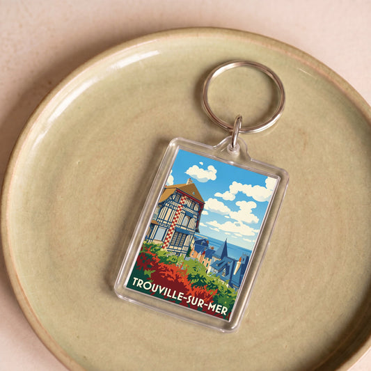 Porte-clés souvenir de la ville de Trouville-sur-Mer avec une illustration stylisée.