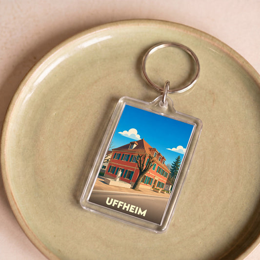 Porte-clés souvenir de la ville d'Uffheim avec une illustration stylisée.