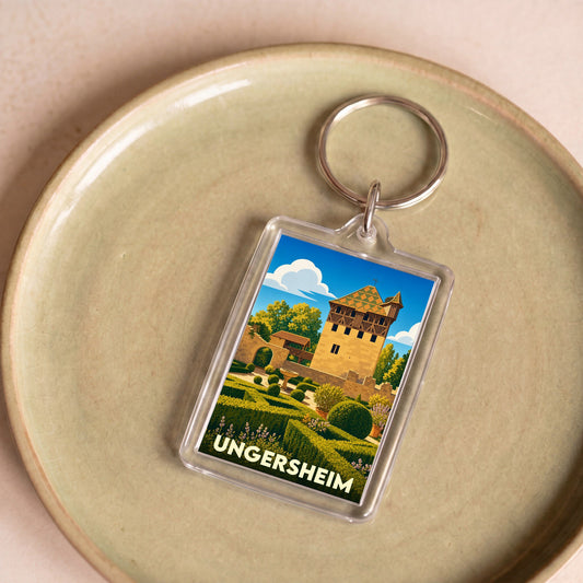 Porte-clés souvenir de la ville de Ungersheim avec une illustration stylisée de son patrimoine architectural.
