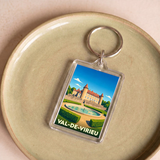Porte-clés souvenir de la ville de Val-de-Virieu avec une illustration stylisée de son château et de ses jardins.