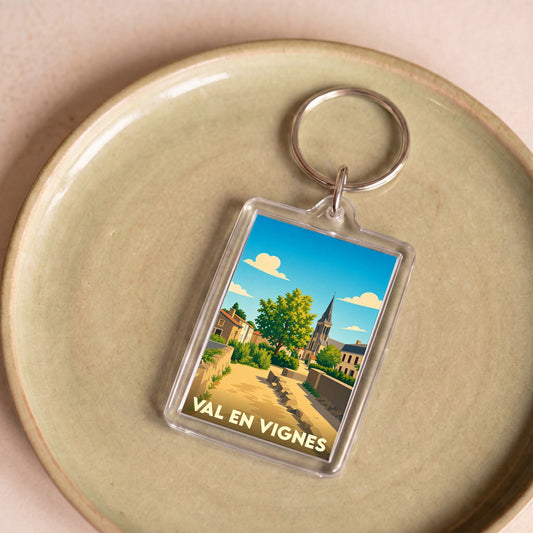 Porte-clés souvenir de la ville de Val en Vignes avec une illustration stylisée.