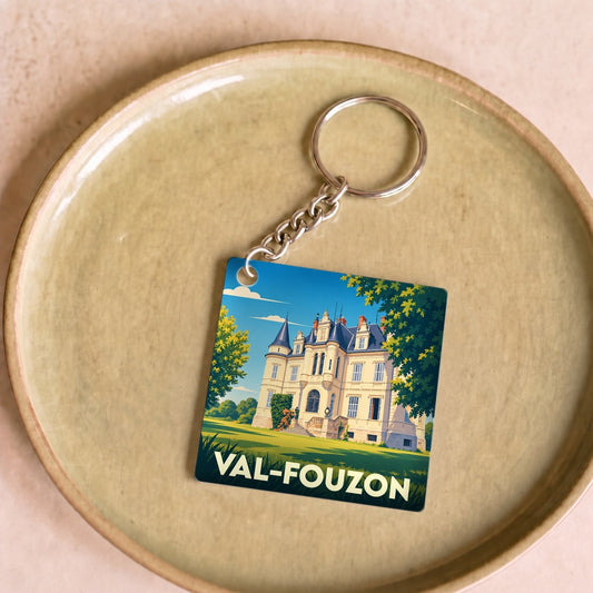 Porte-clés souvenir de la ville de Val-Fouzon avec une illustration stylisée d'un château.