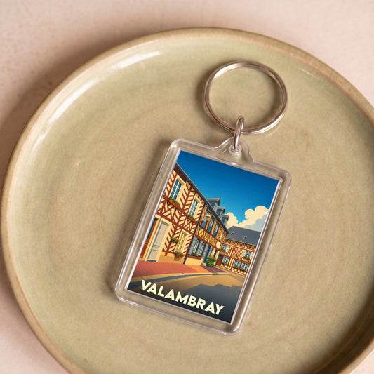 Porte-clés souvenir de la ville de Valambray avec une illustration stylisée de maisons à colombages.