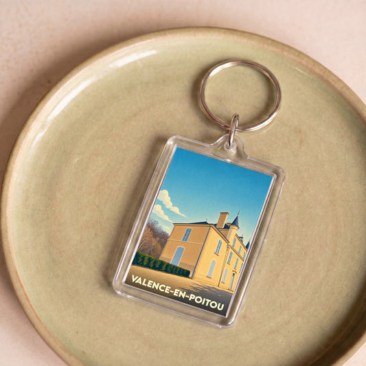 Porte-clés souvenir de la ville de Valence-en-Poitou avec une illustration stylisée.
