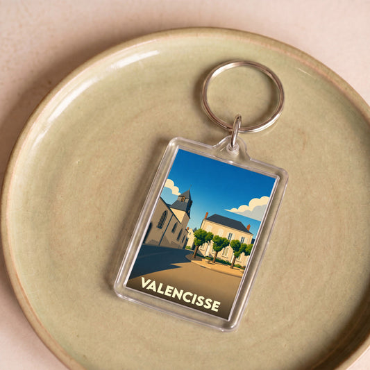 Porte-clés souvenir de la ville de Valencisse avec une illustration stylisée.