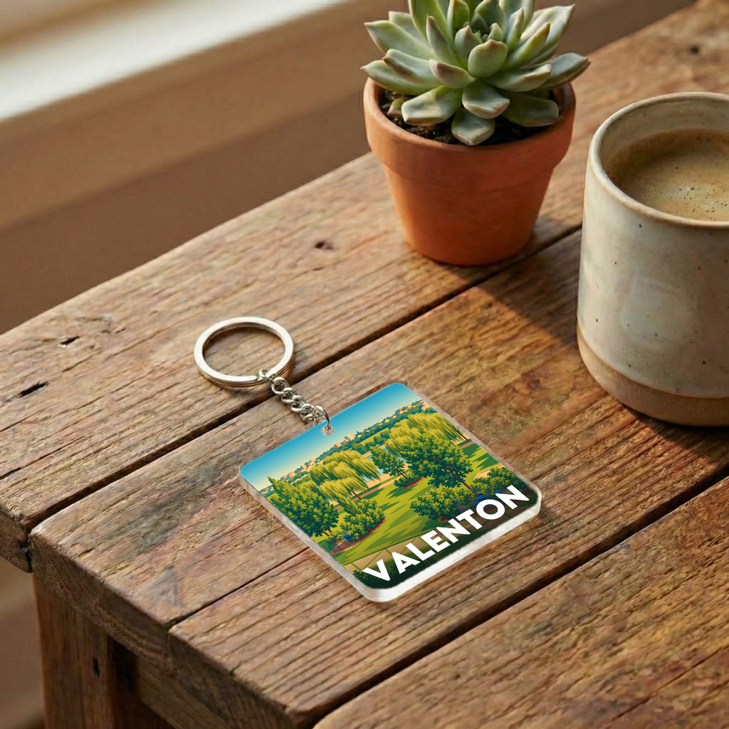 Porte-clés souvenir de la ville de Valenton avec une illustration stylisée d'un paysage verdoyant.