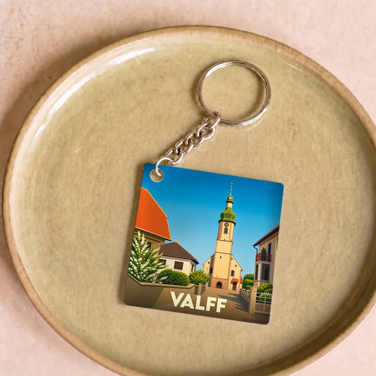 Porte-clés souvenir de la ville de Valff avec une illustration stylisée de son église.