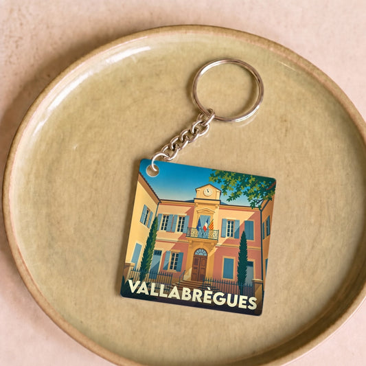 Porte-clés souvenir de la ville de Vallabrègues avec une illustration stylisée de son hôtel de ville.