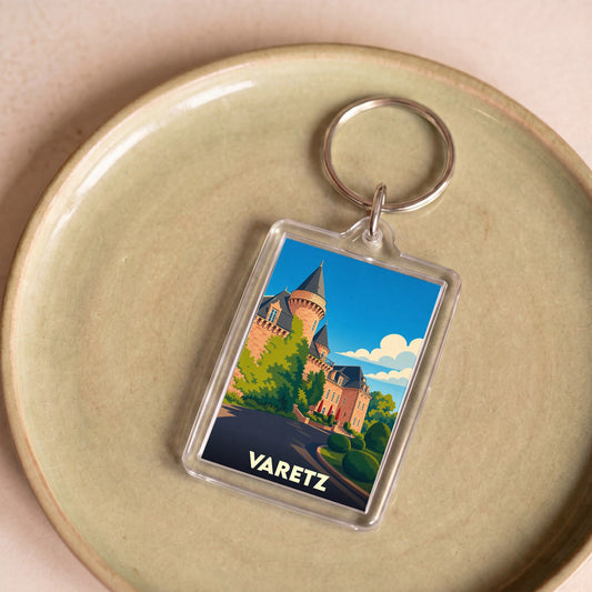 Porte-clés souvenir de la ville de Varetz avec une illustration stylisée d'un château.