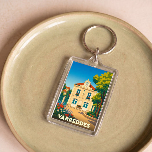 Porte-clés souvenir de la ville de Varreddes avec une illustration stylisée de sa mairie.
