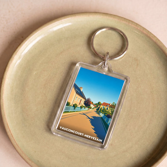 Porte-clés souvenir de la ville de Vauconcourt-Nervezain avec une illustration stylisée.