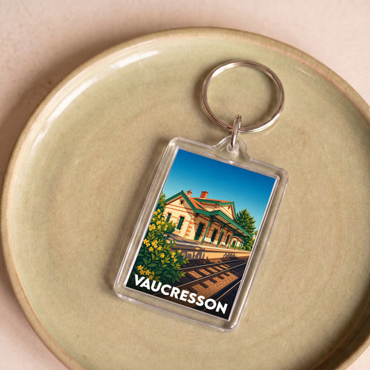 Porte-clés souvenir de la ville de Vaucresson avec une illustration stylisée de sa gare.