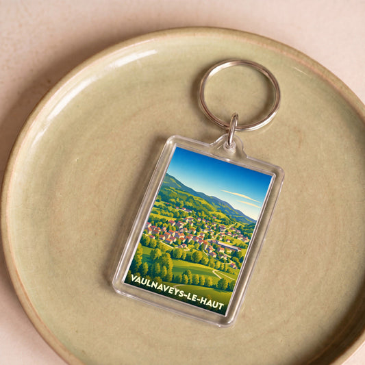 Porte-clés souvenir de la ville de Vaulnaveys-le-Haut avec une illustration stylisée.