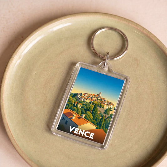 Porte-clés souvenir de la ville de Vence avec une illustration stylisée.
