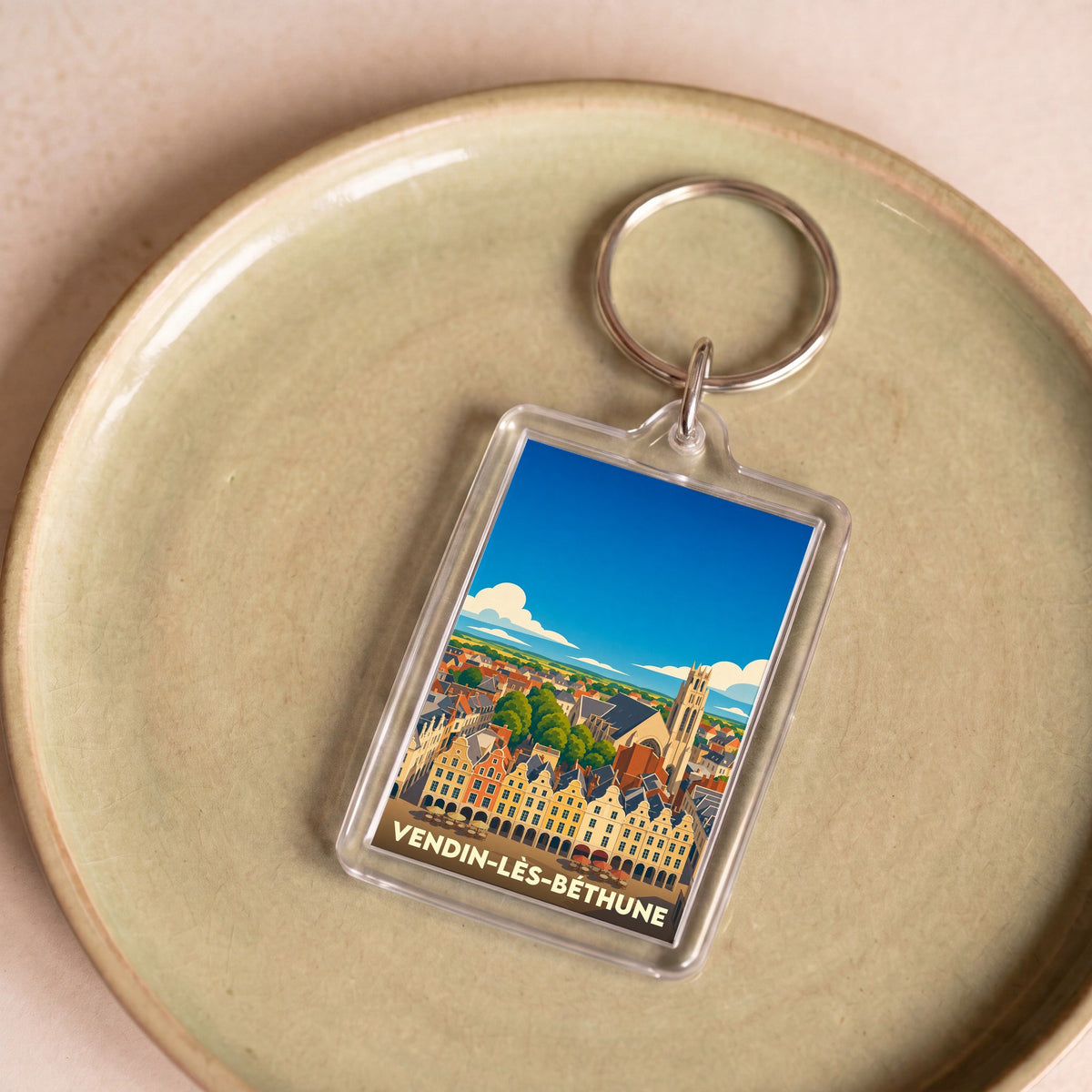 Porte-clés souvenir de la ville de Vendin-lès-Béthune avec une illustration stylisée.