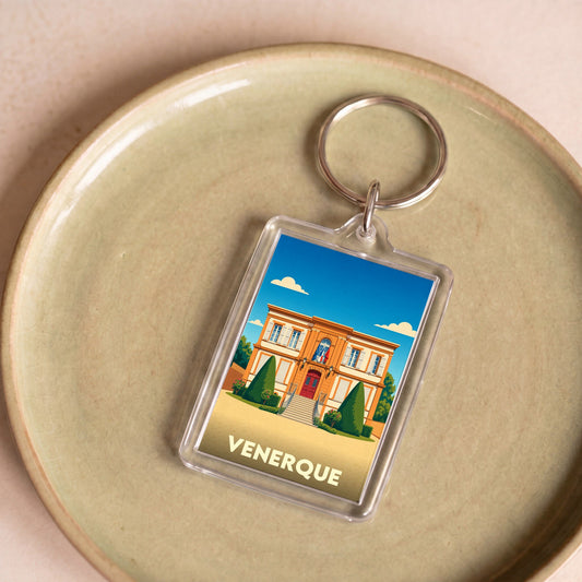Porte-clés souvenir de la ville de Venerque avec une illustration stylisée de sa mairie.