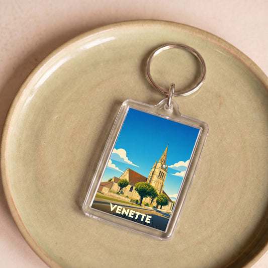 Porte-clés souvenir de la ville de Venette avec une illustration stylisée de son église.