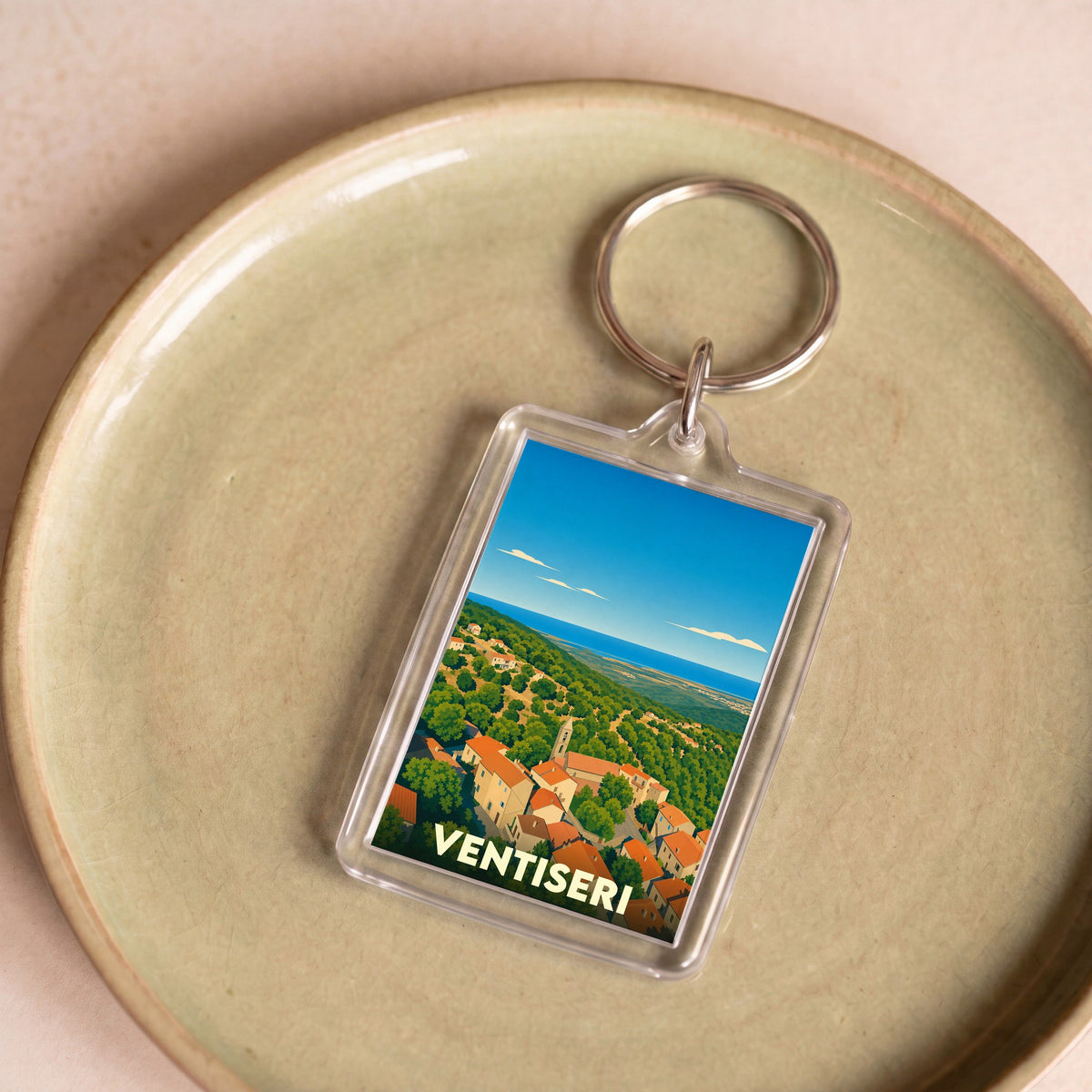 Porte-clés souvenir de la ville de Ventiseri avec une illustration stylisée.