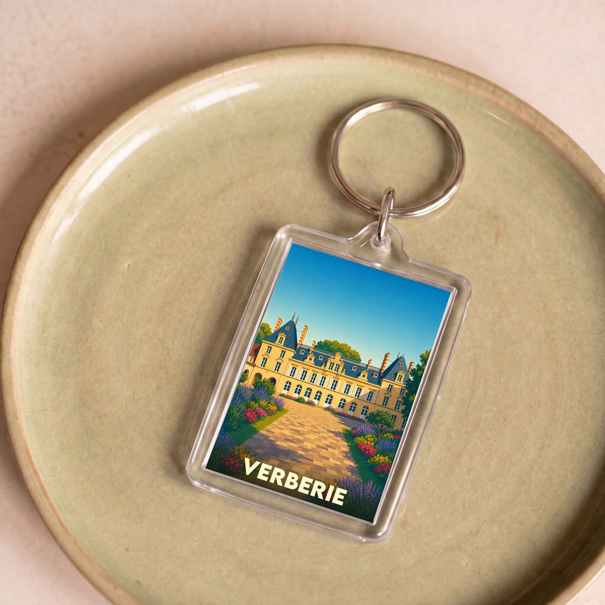 Porte-clés souvenir de la ville de Verberie avec une illustration stylisée de son patrimoine.