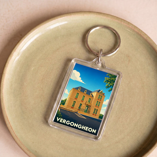 Porte-clés souvenir de la ville de Vergongheon avec une illustration stylisée d'un bâtiment remarquable.