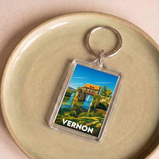 Porte-clés souvenir de la ville de Vernon avec une illustration stylisée.