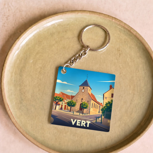 Porte-clés souvenir de la ville de Vert avec une illustration stylisée de son église.