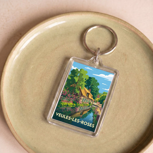 Porte-clés souvenir de la ville de Veules-les-Roses avec une illustration stylisée.