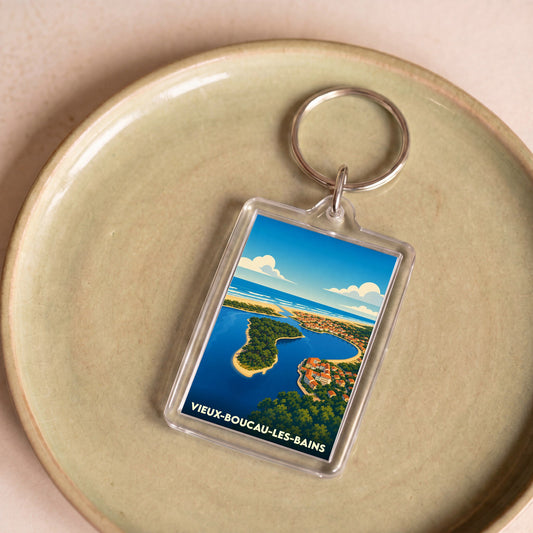 Porte-clés souvenir de la ville de Vieux-Boucau-les-Bains avec une illustration stylisée de son paysage côtier.