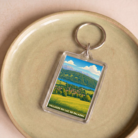 Porte-clés souvenir des Villages du Lac de Paladru avec une illustration paysagère stylisée.