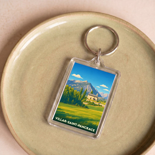 Porte-clés souvenir de la ville de Villar-Saint-Pancrace avec une illustration stylisée d'un paysage montagneux.