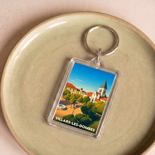 Porte-clés souvenir de la ville de Villars-les-Dombes avec une illustration stylisée.