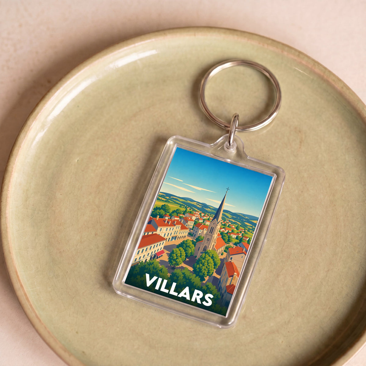 Porte-clés souvenir de la ville de Villars avec une illustration stylisée.