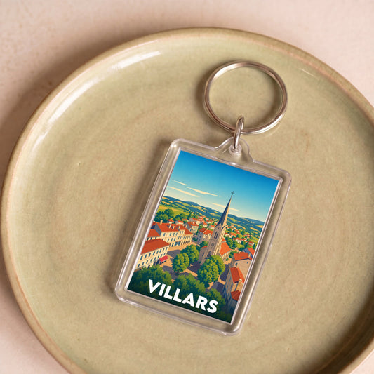 Porte-clés souvenir de la ville de Villars avec une illustration stylisée.