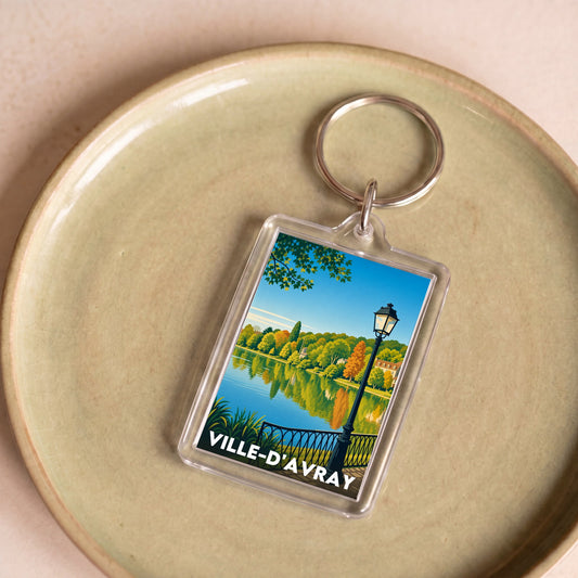 Porte-clés souvenir de la ville de Ville-d'Avray avec une illustration stylisée de ses étangs.
