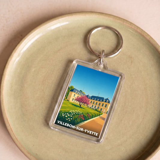 Porte-clés souvenir de la ville de Villebon-sur-Yvette avec une illustration stylisée d'un château.