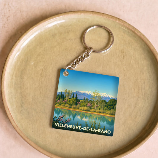 Porte-clés souvenir de la ville de Villeneuve-de-la-Raho avec une illustration stylisée.
