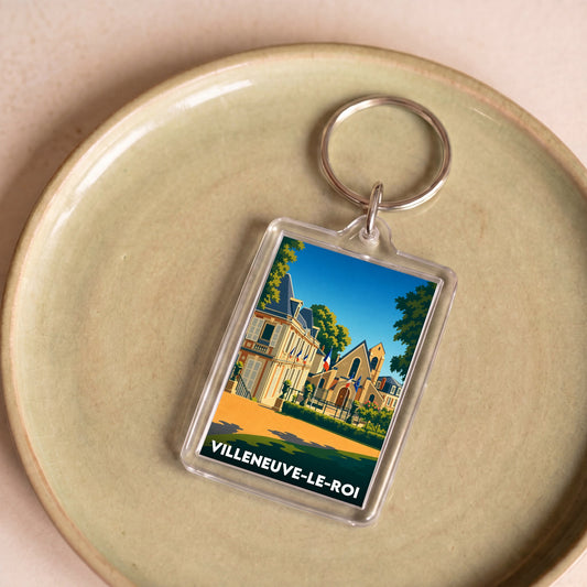 Porte-clés souvenir de la ville de Villeneuve-le-Roi avec une illustration stylisée.